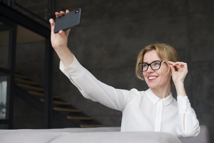 business-woman-taking-selfie-with-smartphone