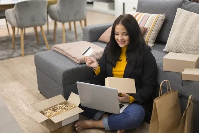 woman-sitting-floor-while-making-new-purchase (1)-1